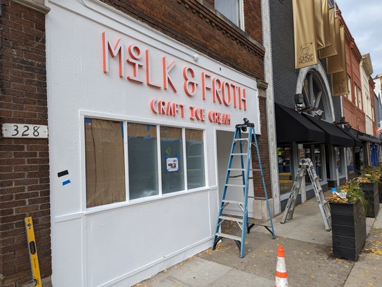 Storefront with a sign: "Milk & Froth Craft Ice Cream"