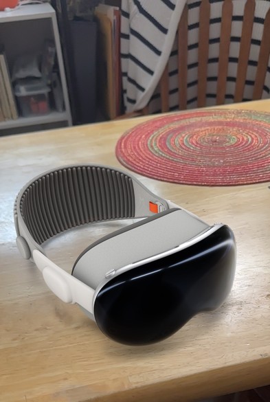 An Apple Vision Pro render sitting on a wooden kitchen table (fake)