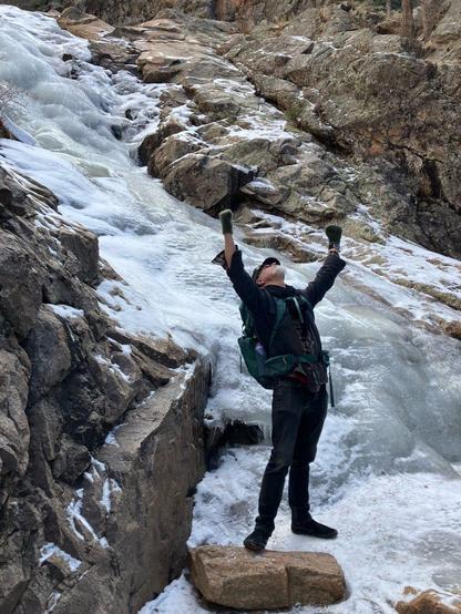 A photo of some foolish ld jackass (me) clowning around on a frozen waterfall near Santa Fe, NM.