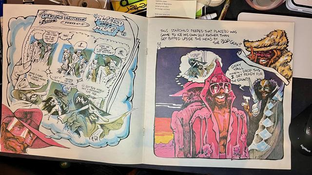 This photo showcases another colorful and elaborate illustrated spread from the Parliament-Funkadelic comic book insert.

The left page is divided into multiple panels, reminiscent of a traditional comic strip, with a predominant light blue border suggesting thought bubbles. The title "Funkadelic Thoughtz Funny's Presents!!!" is at the top. The scene depicts various characters in detailed, eccentric attire interacting within different fantastical settings. Speech bubbles convey dialogue, though the text is small. Sir Nose  is featured prominently in the bottom left, and another section shows figures emerging from a cloud. The artwork is highly detailed, with dynamic poses and expressive faces.

The right page features a larger,unified illustration with a dark purple background at the top transitioning to a sunset-like landscape at the bottom left. Starchild is depicted in a large, pink hooded outfit with glowing eyes, smiling. To his right, another character with a dark complexion and intricate face paint is seen. At the top right, the wild-haired Sir Nose is present in a cloud. A thought bubble above the central figure reads: "THUS, STARCHILD PEEPED THAT PLACEBO WAS GAME TO ICE HIS OWN SELF RATHER THAN GET BOPPED UPSIDE THE HEAD BY THE BOP GUN!!" Another speech bubble near the central figure exclaims: "OKAY Y'ALL WHEN I DROP THIS I GET READY FOR THE COUNT!!"

The artwork is rich in detail, color, and character, perfectly aligning with the Parliament-Funkadelic universe.