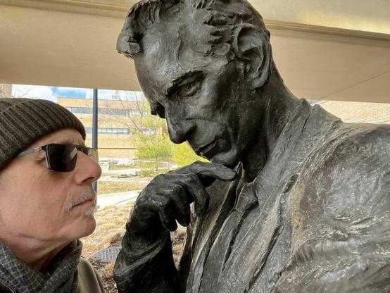 This is an encounter between [me] and a bronze bust of Claude Shannon (1916-2001), the brilliant mathematician and electrical engineer who is considered the "father of information theory."

This bust stands right in front of the EECS (Electrical Engineering and Computer Science) Building at Michigan, honoring one of their most distinguished alumni. It's a fitting tribute - Shannon's work literally shaped the entire field that building represents.

About Claude Shannon:
Created the mathematical …