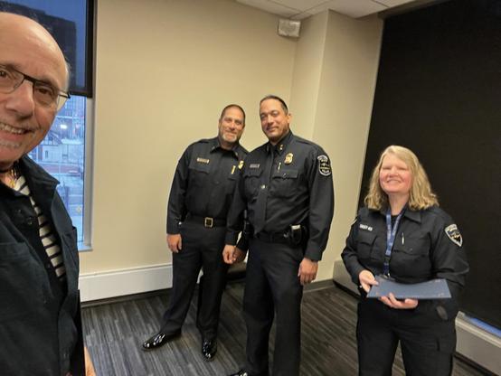 selfie receiving my certificate of graduation from commander dunlap and his minions